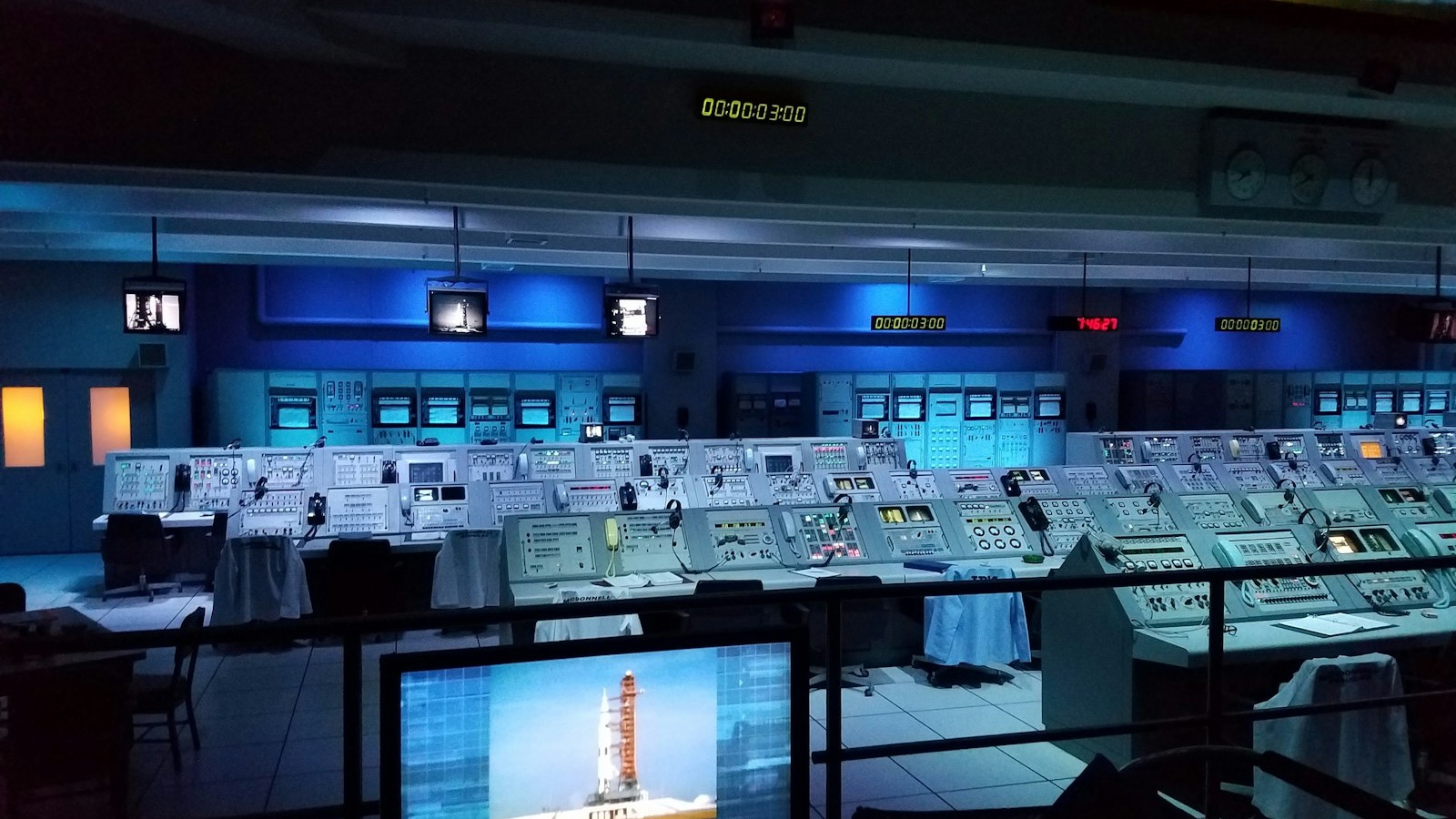 Rows of operator consoles in a mission control room